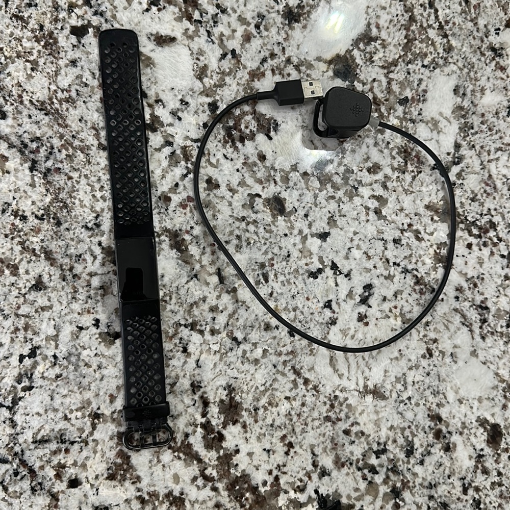 Fitbit charge 4 with charger.  Used but in great shape!